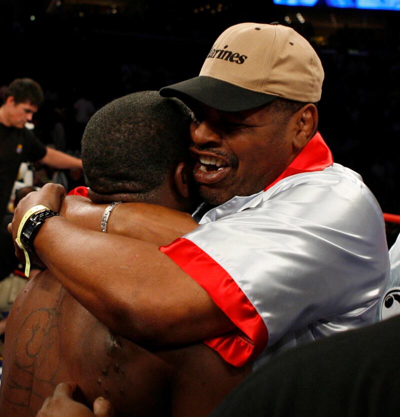 Leon Spinks hugs his son Cory after the WBC & WBO World Middleweight Championship against Jermain Taylor at the FedEx Forum in Memphis, Tennessee, on May 19, 2007. EPA