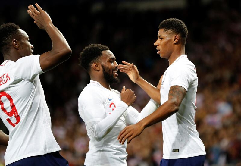 Soccer Football - International Friendly - England v Switzerland - King Power Stadium, Leicester, Britain - September 11, 2018  England's Marcus Rashford celebrates scoring their first goal with Danny Rose and Danny Welbeck   REUTERS/Darren Staples