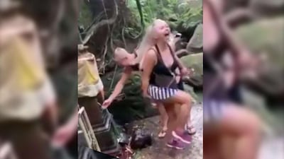 The now-deleted video shows the couple splashing each other with holy water. Instagram