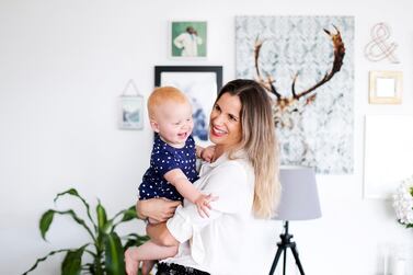 Mette Jensen works from home, giving her more time with her daughter, Sienna. Reem Mohammed / The National