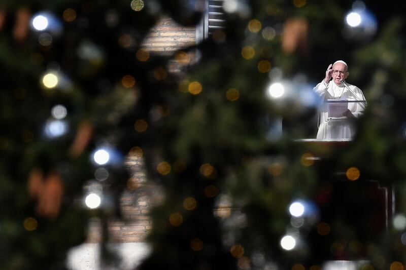 Pope Francis addresses the crowd from the window of the apostolic palace overlooking Saint Peter's square at The Vatican. AFP
