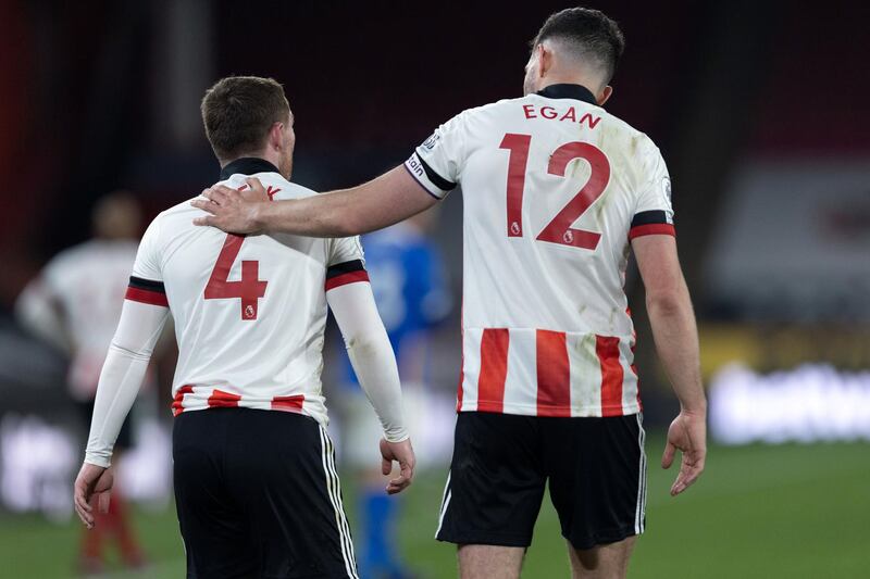 John Egan of Sheffield United checks on John Fleck of Sheffield United during the Premier League match between Sheffield United and Brighton and Hove Albion at Bramall Lane, Sheffield on 24th April 2021. (Photo by Pat Scaasi|/MI News/NurPhoto via Getty Images)