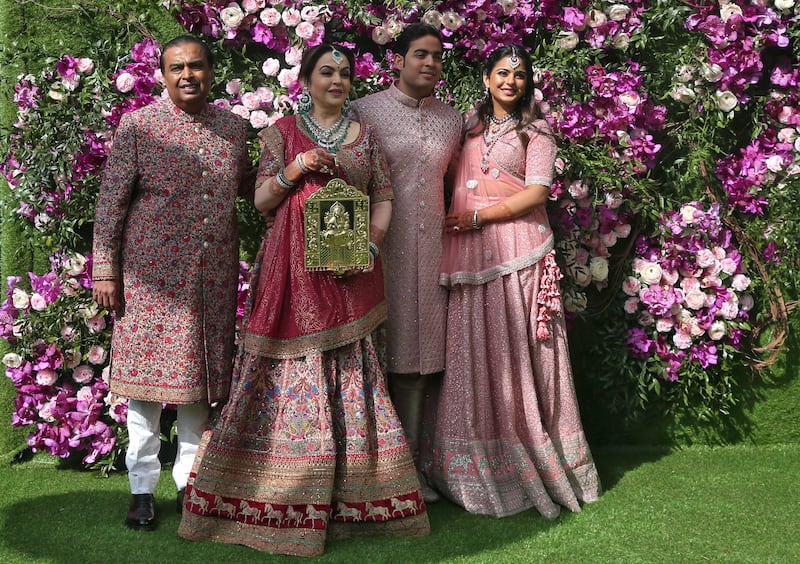 The Ambanis with their children Akash and Isha. The family were united for Akash's wedding in March 2019. Reuters 