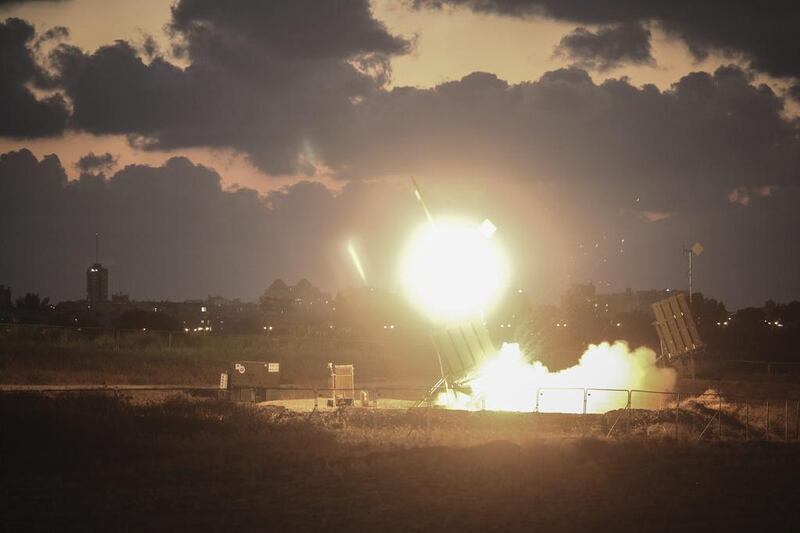 Israel's Iron Dome air-defence system fires to intercept a rocket over the city of Ashdod on July 16, 2014.  Ilia Yefimovich / Getty Images