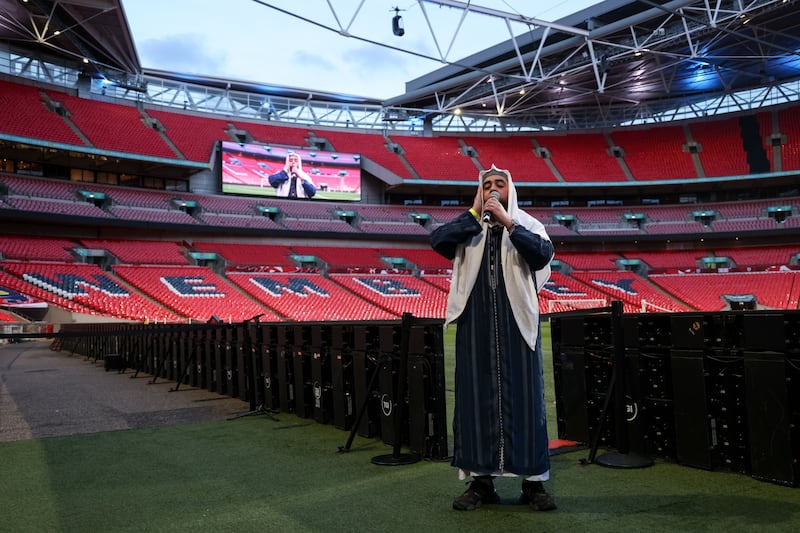 Mohammed Ismaeel Asif led a call to prayer at the Wembley pitchside before guests broke their Ramadan fast. Getty Images