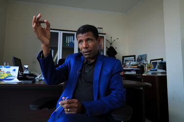 Haile Gebrselassie, Ethiopian Olympic gold medallist and national hero, who pledged on Wednesday to join the fight against rebellious forces, gestures at his office in Addis Ababa, Ethiopia November 24, 2021.  REUTERS / Tiksa Negeri