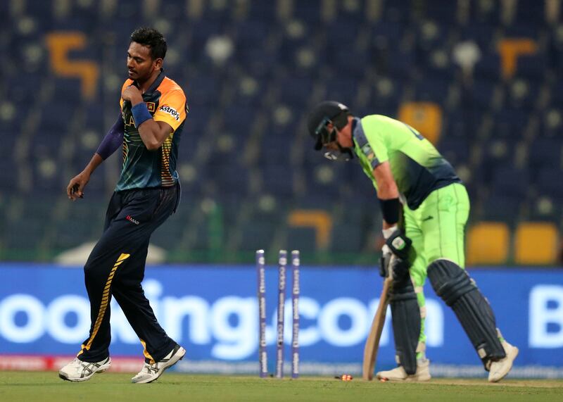 Sri Lanka's Dushmantha Chameera takes the wicket of Ireland's Craig Young in Abu Dhabi. Chris Whiteoak / The National