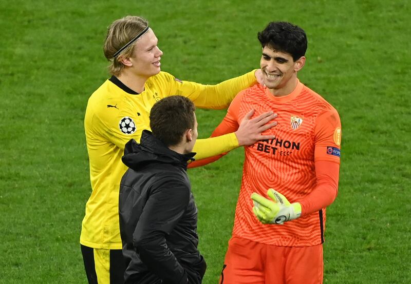Borussia Dortmund's Erling Braut Haaland and Sevilla's Bono after the match. Reuters