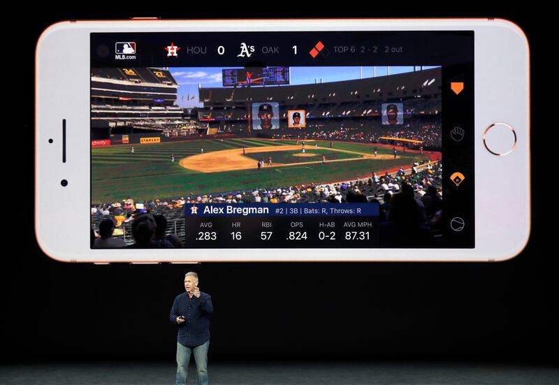 Phil Schiller, Apple's senior vice president of worldwide marketing, shows features of the new iPhone 8 at the Steve Jobs Theater on the new Apple campus in Cupertino, California. Marcio Jose Sanchez / AP Photo