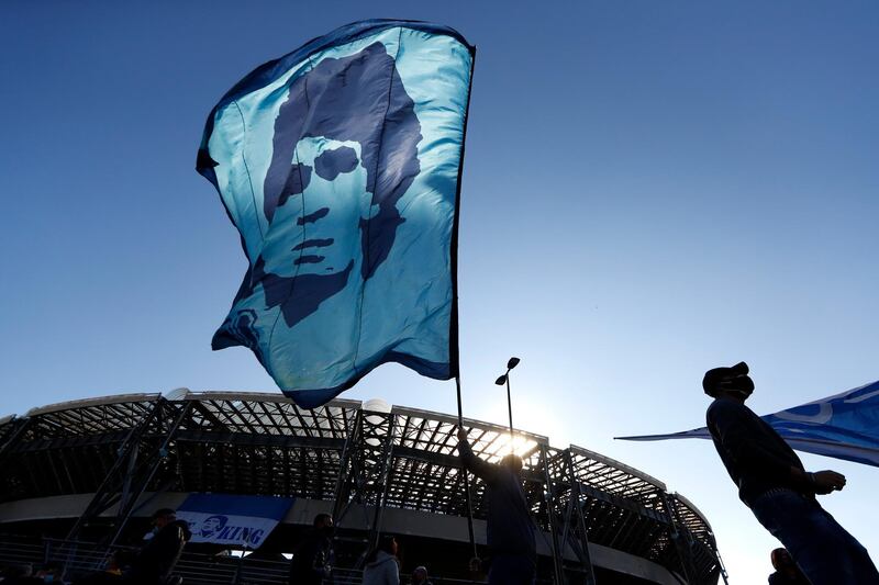 A person waves a Diego Maradona flag outside the Stadio San Paolo in Naples. Reuters