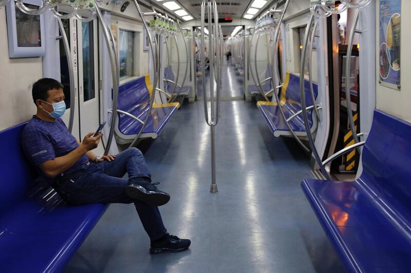 A man wearing a face mask rides the subway, following new cases of the coronavirus disease infections in Beijing, China. Reuters
