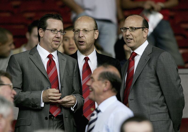 Joel Glazer, Avram Glazer and Bryan Glazer at Old Trafford to watch a match in August 2005