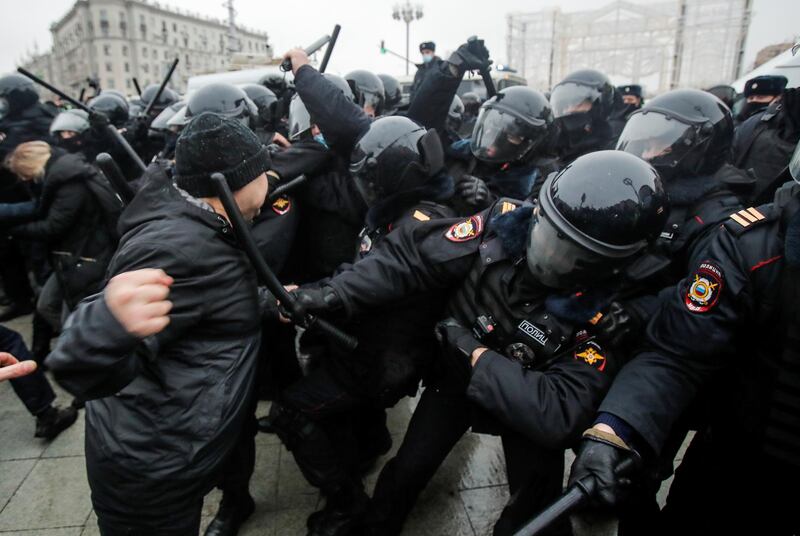 Law enforcement officers clash with protesters during a rally in support of jailed Russian opposition leader Alexei Navalny in Moscow. Reuters