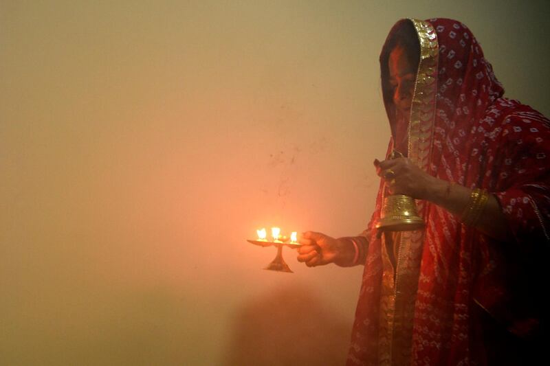 A Hindu devotee takes part in a ritual during the ‘Chhath Puja’ festival in Kathmandu. AFP