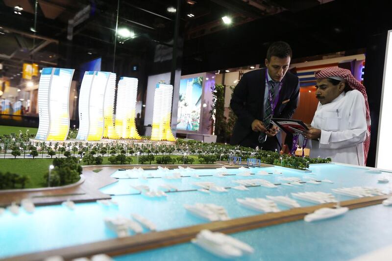 Visitors look at the model of Marina project at the DAP Yapi Istanbul stand. Pawan Singh / The National