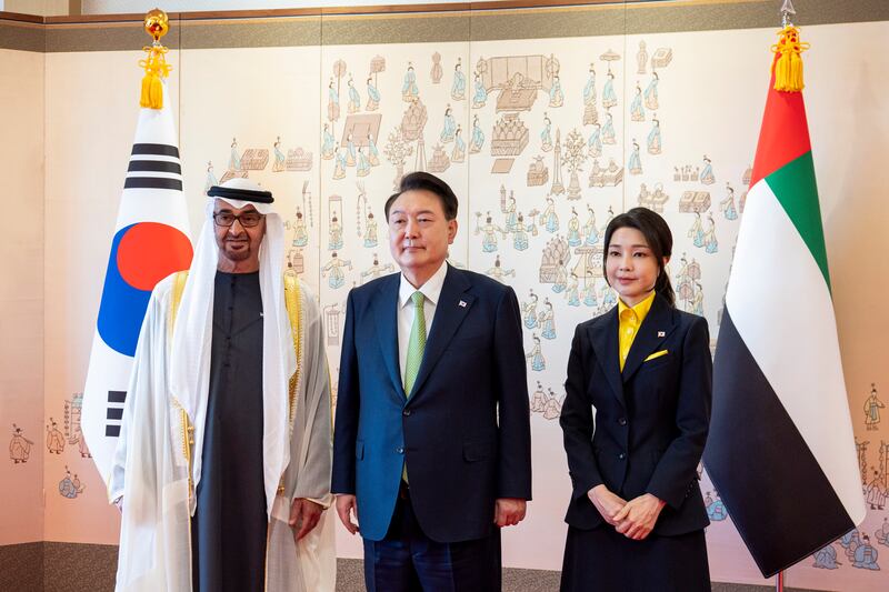 Sheikh Mohamed, Mr Yoon and the first lady. Ryan Carter / UAE Presidential Court 