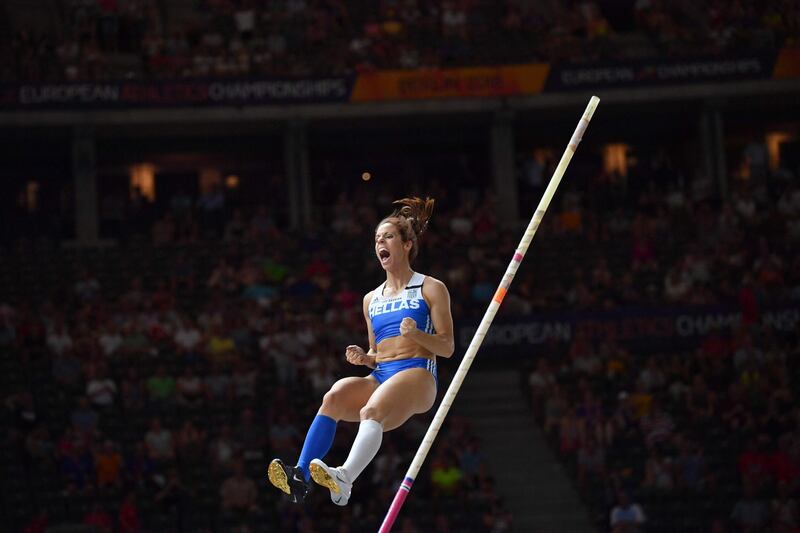 Greece's Ekaterini Stefanidi reacts as she lands her winning attempt in the women's Pole Vault final during the European Athletics Championships at the Olympic stadium in Berlin.  AFP