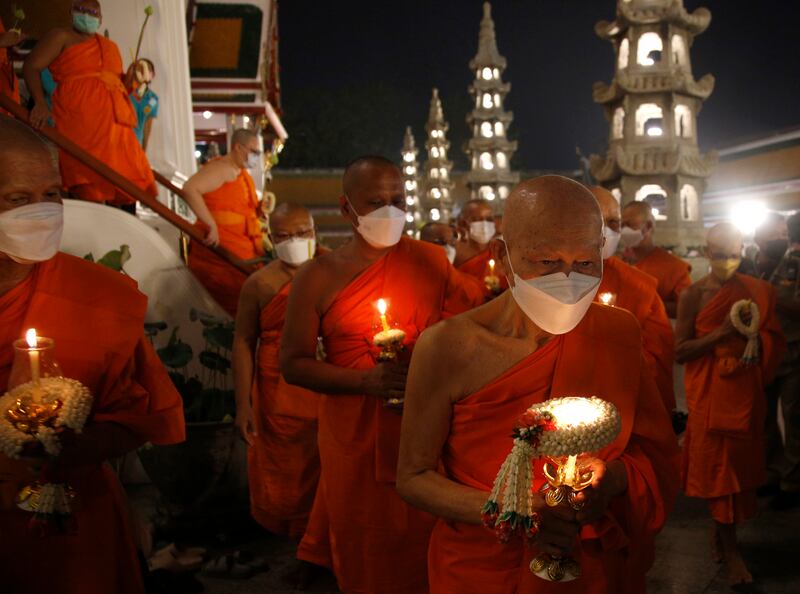 Buddhist monks circle around Wat Suthat temple in Bangkok as they commemorate Makha Bucha Day. EPA