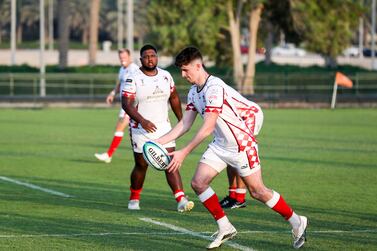 James McCarthy kicks off at the first rugby match for Abu Dhabi Harlequins vs. Jebel Ali Dragons at Zayed Sports City. Khushnum Bhandari/ The National
