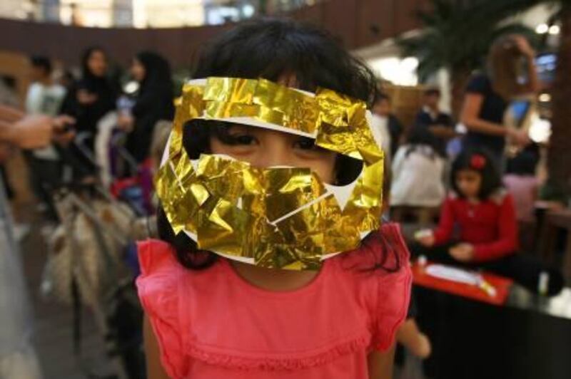 DUBAI, UNITED ARAB EMIRATES Ð July 19: Maryum Al Mulla (5 year old) wearing traditional burqa after making it in the Emirati Cultural festival as part of the Dubai Summer Surprise 2011 at Dubai Mall in Dubai. (Pawan Singh / The National) For News. Story by Colin