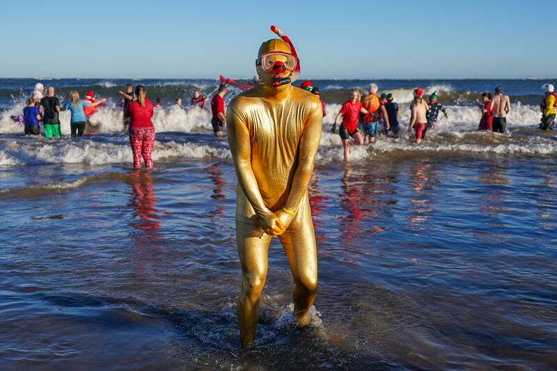 Bathers brave the cold waters of the North Sea as they take part in the annual Boxing Day dip in Redcar, England. Getty Images