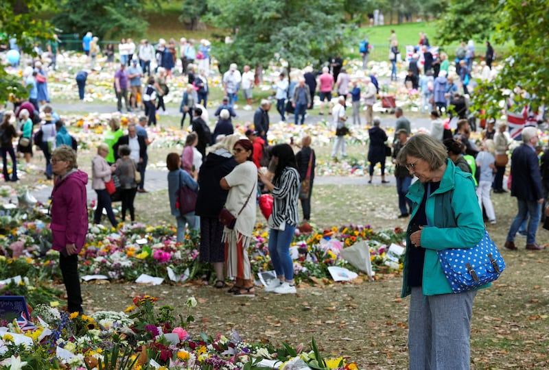 People view floral tributes at Green Park, following the death of Britain's Queen Elizabeth, near Buckingham Palace in London. Reuters
