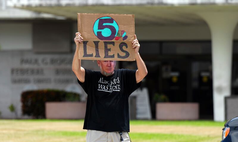 A Trump supporter outside the Paul S  Rogers Federal Building and US Courthouse in West Palm Beach, Florida. AP