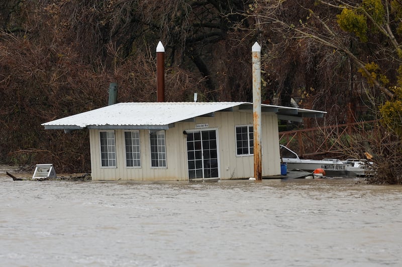 A partially submerged boathouse on the Sacramento River on Tuesday. Reuters
