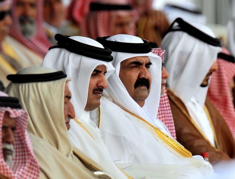 epa01969553 Emir of Qatar Hamad bin Khalifa al-Thani (C-R) and Crown Prince of Qatar Sheikh Tamim  Bin Hamad Al-Thani (C -L) attend a military parade at the Doha Corniche  to mark the Qatar National Day on 18 December 2009.On the 18th of December, Qatar celebrates its National Day in commemoration of the historic day in 1878 when Shaikh Jasim, the founder of the State of Qatar,succeeded his father, Shaikh Muhammad Bin Thani, as a ruler and led the country toward unity.  EPA/STR *** Local Caption ***  01969553.jpg