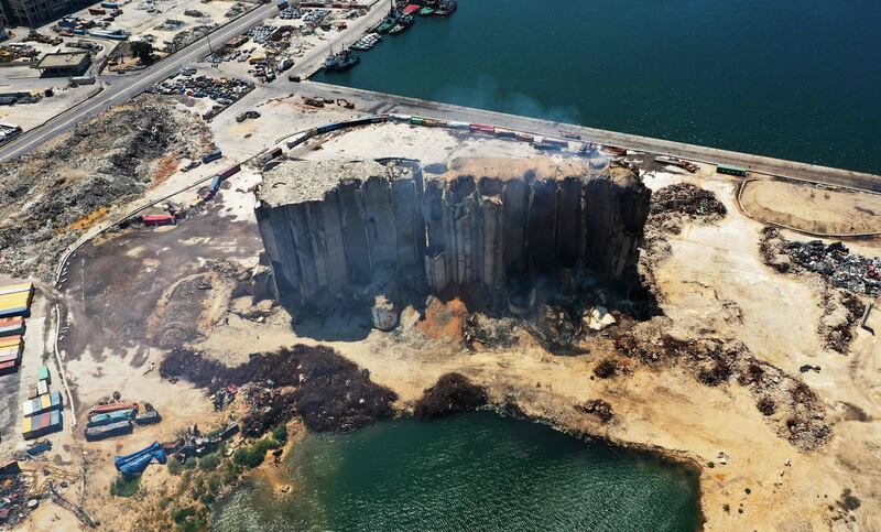 Smoke rises from ruined grain silos in Beirut port on Friday, days before Lebanon marks two years since the August 4, 2020 explosion that killed at least 200 people on the site. Fermentation of grain and rising temperatures combined to start small fires last week. AFP