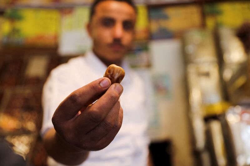 A vendor shows a date at his shop.