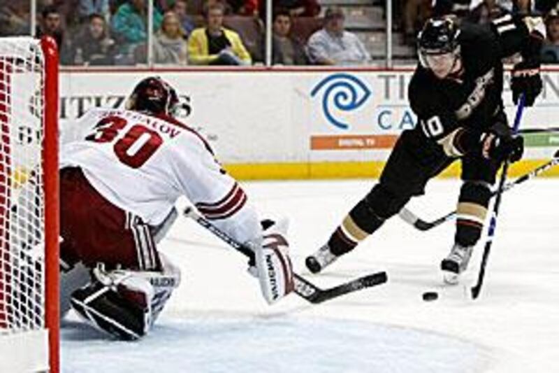 The Ducks' Corey Perry skates in on the Phoenix netminder Ilya Bryzgalov.