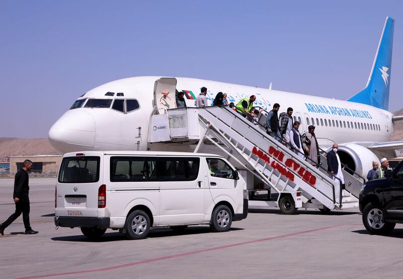 Passengers disembark on arrival from Kandahar at Hamid Karzai International Airport in Kabul, Afghanistan. Reuters