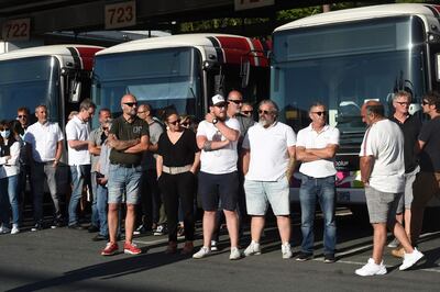 Bus drivers of the public transport network of Bayonne, southwestern France, waits for the visit of French Junior Transports Minister on July 7, 2020, a day after one of them was declared brain dead after being attacked for refusing to let aboard passengers without face masks in line with rules imposed to combat the coronavirus. A police source in Bayonne, near the ritzy Atlantic resort of Biarritz said five people were now in custody over the incident on July 5 evening. / AFP / GAIZKA IROZ

