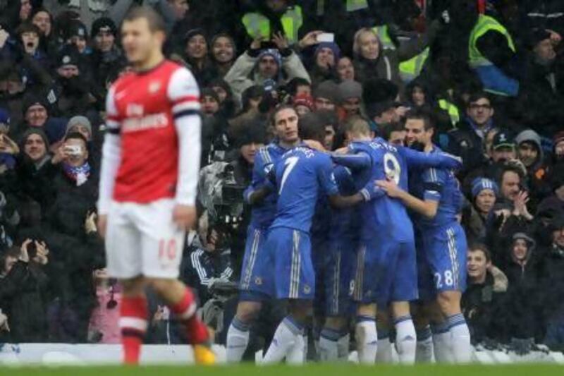 Chelsea's players celebrate Juan Mata's goal against Arsenal. Sang Tan / AP Photo