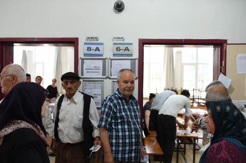 People wait in queue to cast their ballots at a polling station in Yalova, Turkey, on June 24, 2018. Burak Kara / Getty Images