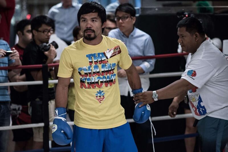 Manny Pacquiao's promoter, Bob Arum, has revealed the boxing superstar has signed his part of the deal to fight Floyd Mayweather on May 2. Philippe Lopez / AFP
