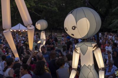 Giant luminous inflatable puppets perform in Geneva, Switzerland. EPA

