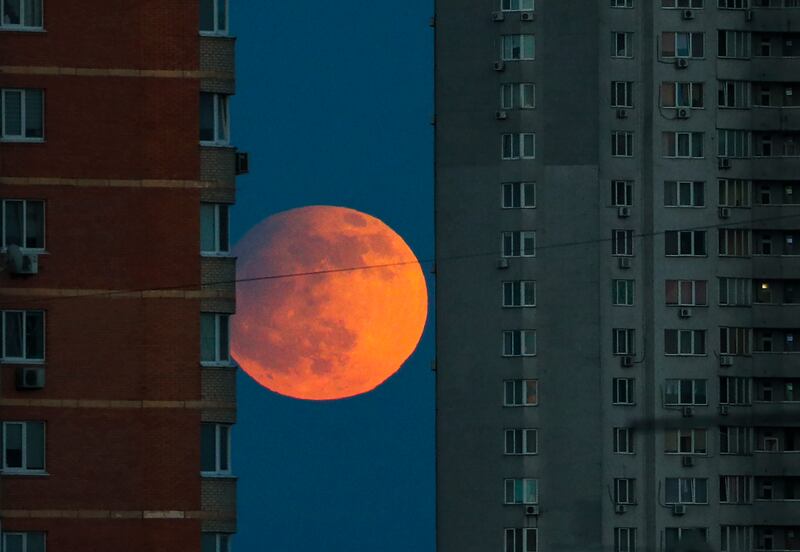 The lunar eclipse between residential buildings in Kyiv, Ukraine, on May 5, 2023. EPA