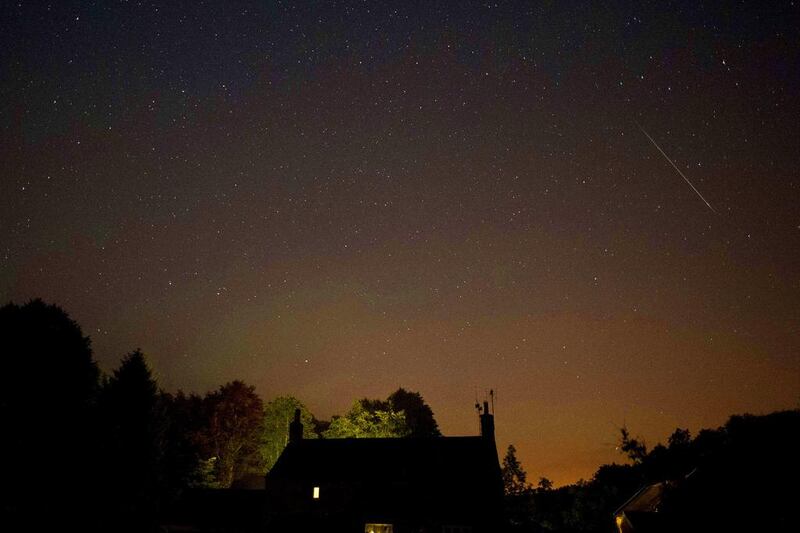 A meteor passes above the village of Rievaulx, northern England. Oli Scarff / AFP Photo