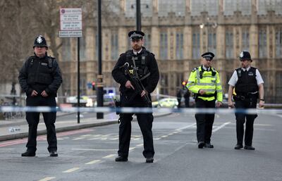 Armed officers on standby outside the Houses of Parliament in March 2017 after a police officer was stabbed and the alleged assailant shot by armed police. Getty