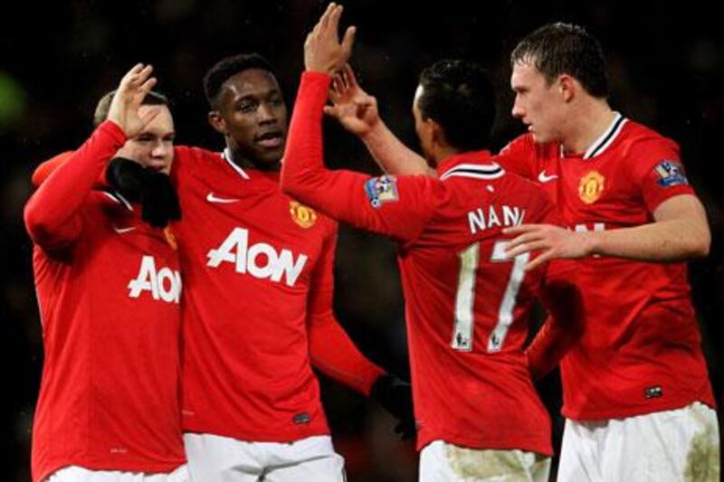 With goals by Wayne Rooney, far left, and Nani, second from the right, all seems right for Manchester United again. But that will not stop the rumours that Sir Alex Ferguson may make a big move to rejunvenate the club during the January transfer window.