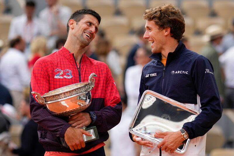 Novak Djokovic alongside runner-up Casper Ruud. AP