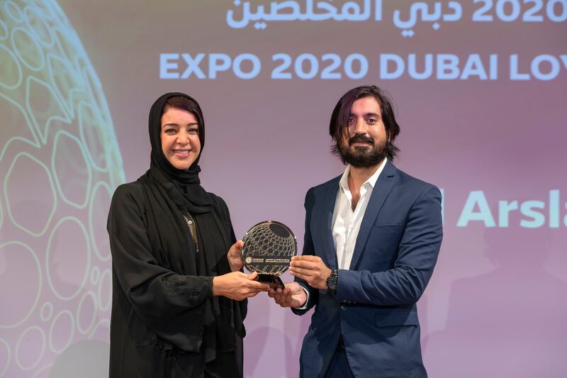 Reem Al Hashimy, Minister of State for International Cooperation and Director General of Expo 2020 Dubai presents an award to one of the top 50 most loyal visitors. Photo by Christopher Edralin/Expo 2020 Dubai