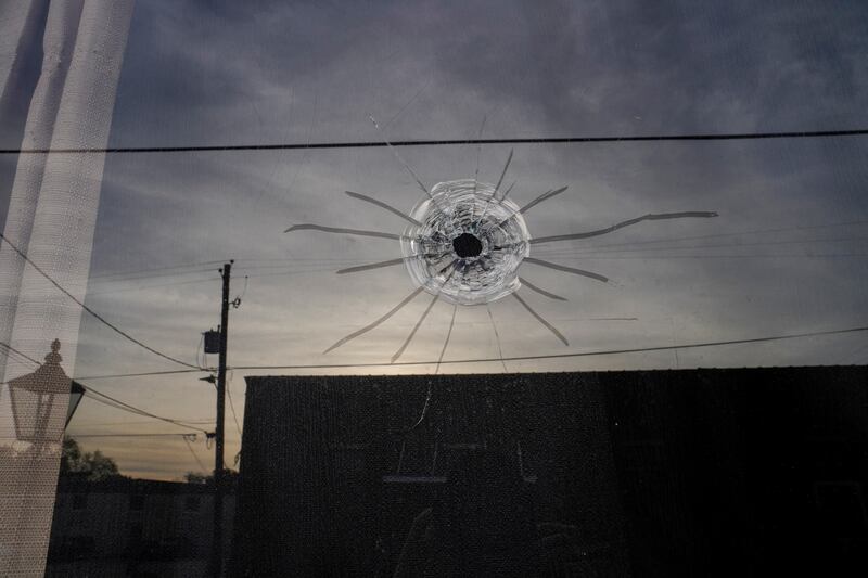 A bullet hole  at the entrance of Mahogany Masterpiece Dance Studio. Reuters