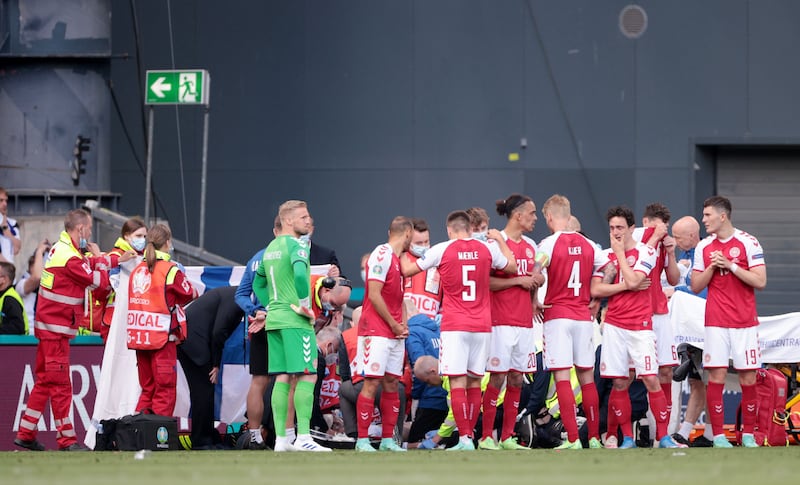 Denmark players react as Christian Eriksen receives medical attention after collapsing during their Euro 2020 match against Finland in June. Reuters