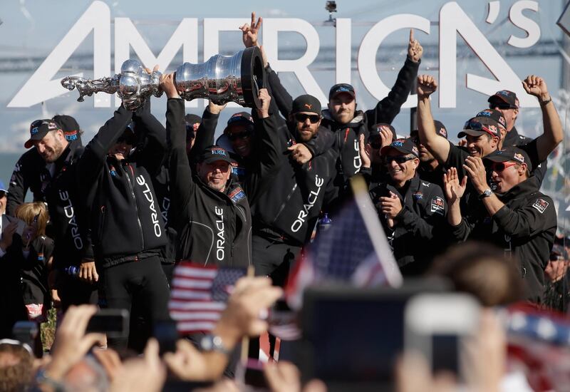 SAN FRANCISCO, CA - SEPTEMBER 25:  Oracle CEO Larry Ellison celebrates with the America's Cup trophy after Oracle Team USA beat Emirates Team New Zealand skippered by Dean Barker in race 19 to win the America's Cup Finals on September 25, 2013 in San Francisco, California.  (Photo by Ezra Shaw/Getty Images)