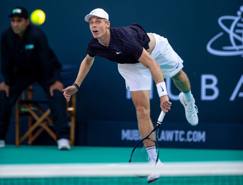 Denis Shapovalov serves to Taylor Fritz during their quarter-final match at the Mubadala World Tennis Championship at Zayed Sports City, Abu Dhabi on December 16, 2021. Victor Besa / The National