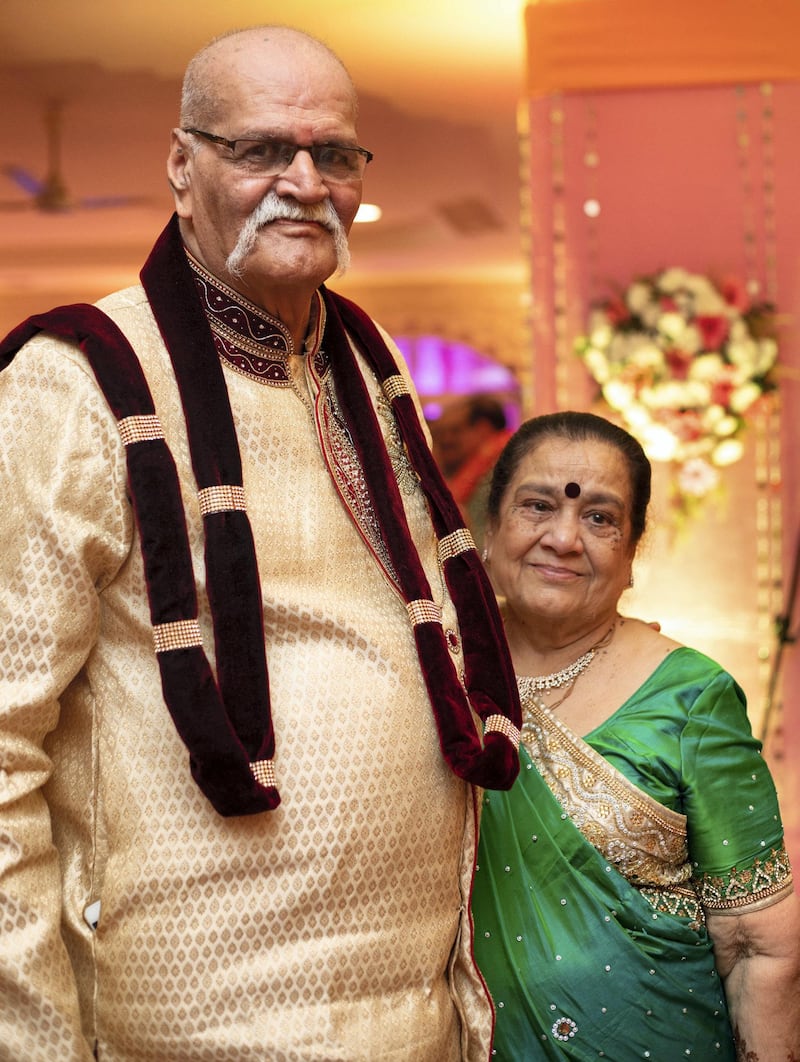 Kishan Gandhi and his wife Lata at the wedding of their granddaughter in January last year. The elderly couple died of Covid-19 within 48 hours of each other. Their family is keen to remind people to stay safe. Courtesy: Gandhi family