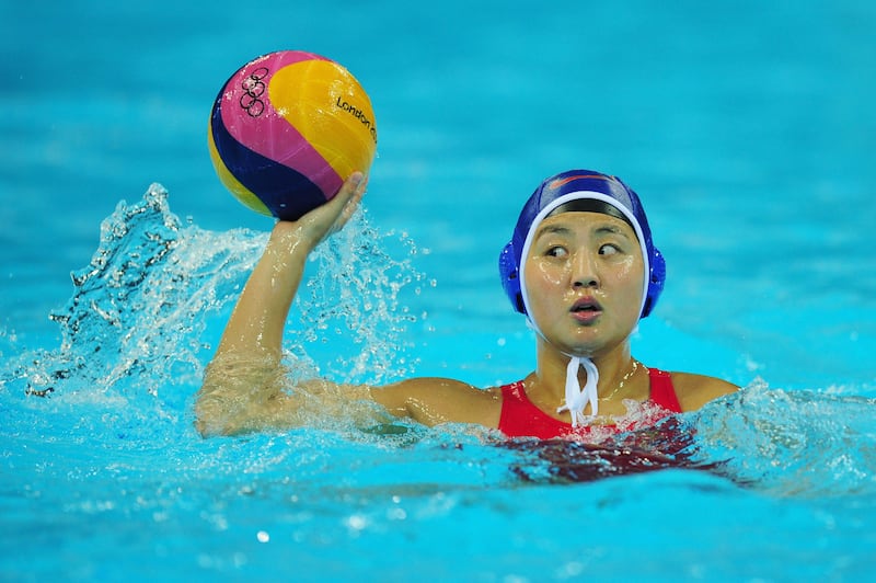 LONDON, ENGLAND - JULY 30:  Yujun Sun of China looks for a pass during the Women's Water Polo Preliminary match between Spain and China on Day 3 of the London 2012 Olympic Games  at Water Polo Arena on July 30, 2012 in London, England.  (Photo by Stu Forster/Getty Images)